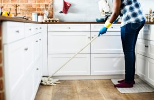 person shown mopping floors